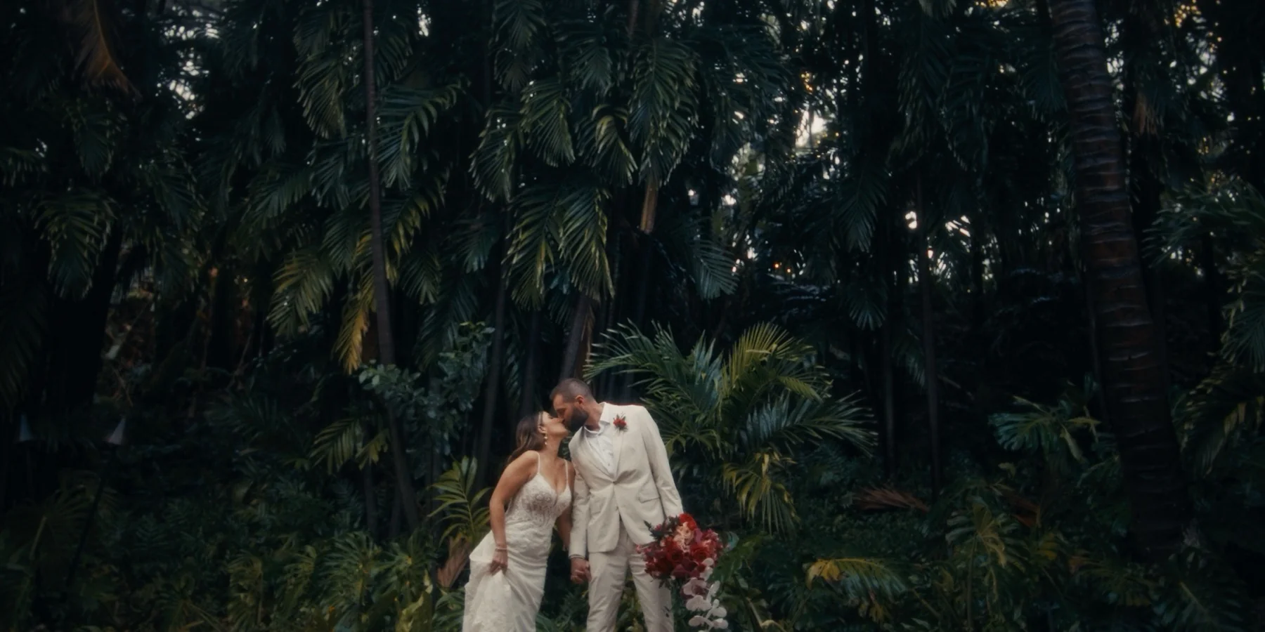 Grand Wailea wedding film frame of Erica & Brett in the tropical gardens