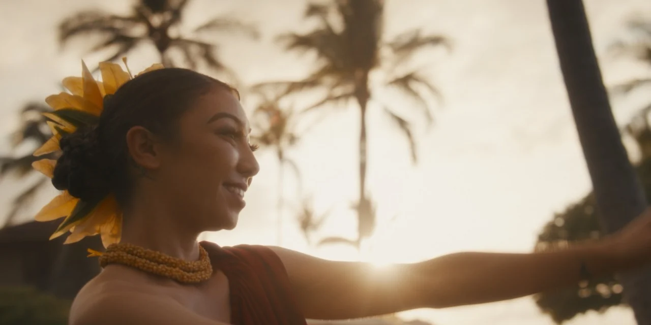A hula dancer performs in warm sunset light at Jaime and Travis’s wedding.