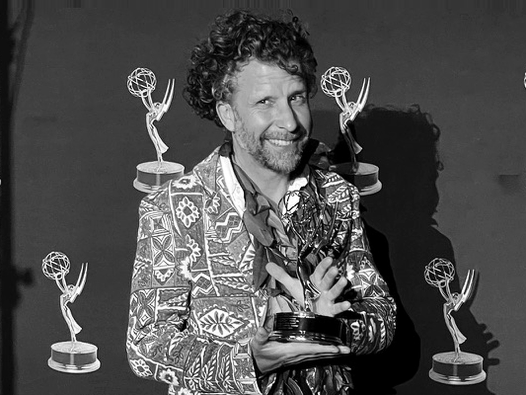 Stephan Boeker holding an Emmy award