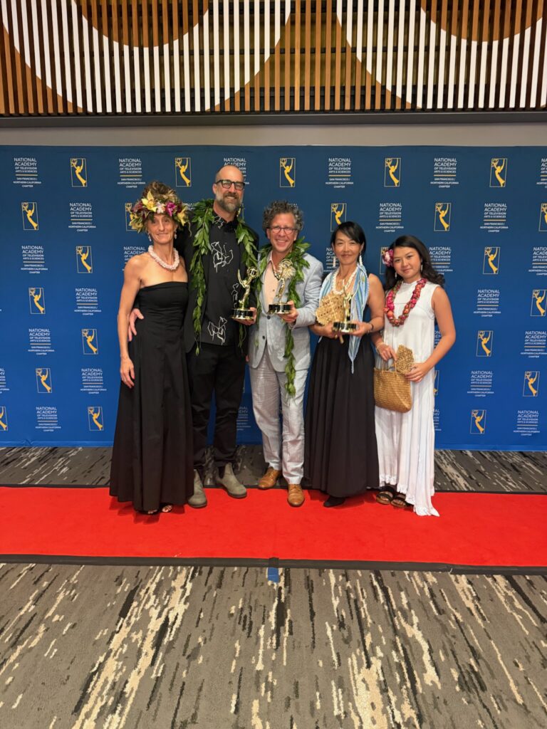 The Journey Beyond the Grid ceremony party poses with Pacific Storytellers’ three Emmy statuettes.