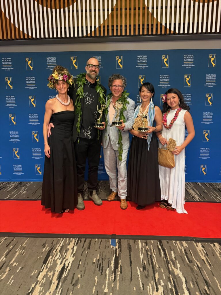 The Journey Beyond the Grid ceremony party poses with Pacific Storytellers’ three Emmy statuettes.