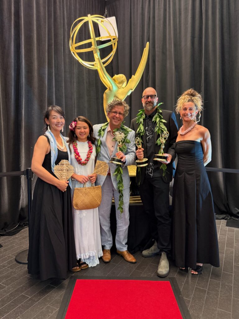 The Journey Beyond the Grid ceremony party poses with Pacific Storytellers’ three Emmy statuettes.