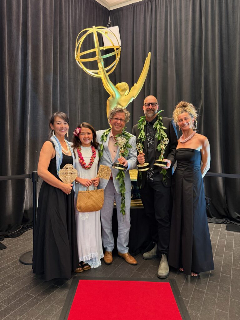 The Journey Beyond the Grid ceremony party poses with Pacific Storytellers’ three Emmy statuettes.
