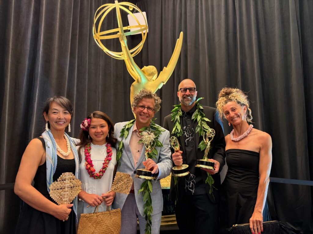 The Journey Beyond the Grid ceremony party poses with Pacific Storytellers’ three Emmy statuettes.