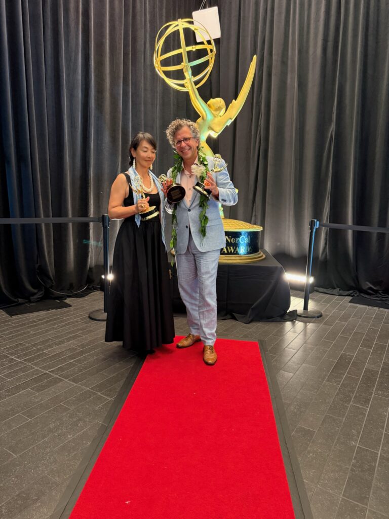 Stephan and Kazuko Boeker pose with Pacific Storytellers’ Emmy statuettes at the 2026 ceremony.