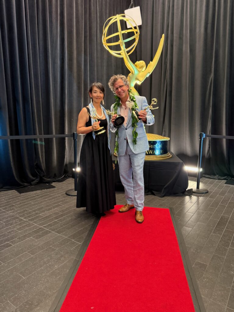 Stephan and Kazuko Boeker pose with Pacific Storytellers’ Emmy statuettes at the 2026 ceremony.