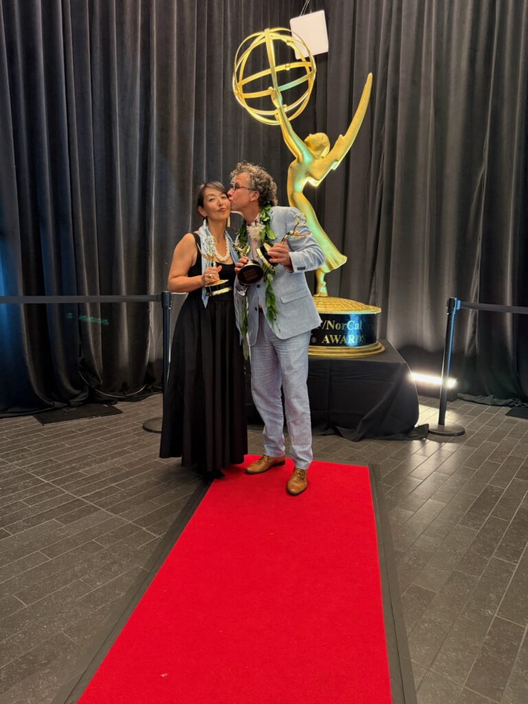 Stephan and Kazuko Boeker pose with Pacific Storytellers’ Emmy statuettes at the 2026 ceremony.