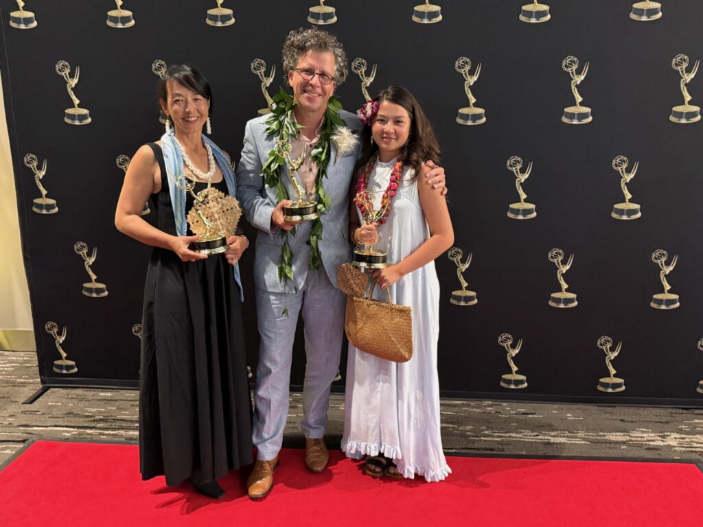Stephan Boeker poses with Kazuko and Frida while the family holds Pacific Storytellers’ three Emmy statuettes.