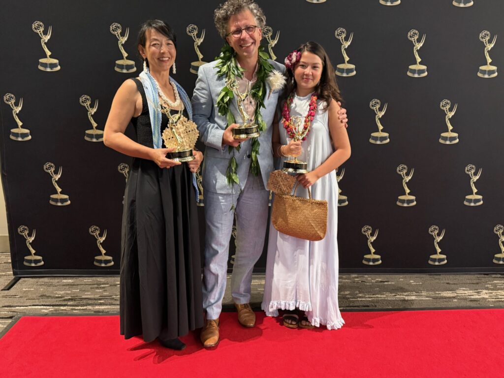 Stephan Boeker poses with Kazuko and Frida while the family holds Pacific Storytellers’ three Emmy statuettes.