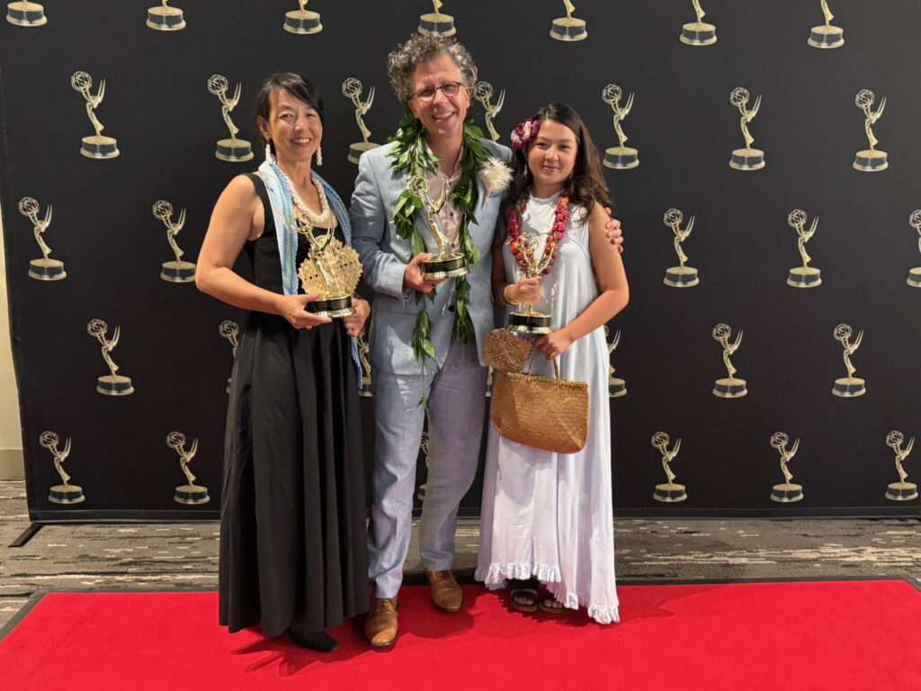 Stephan Boeker poses with Kazuko and Frida while the family holds Pacific Storytellers’ three Emmy statuettes.