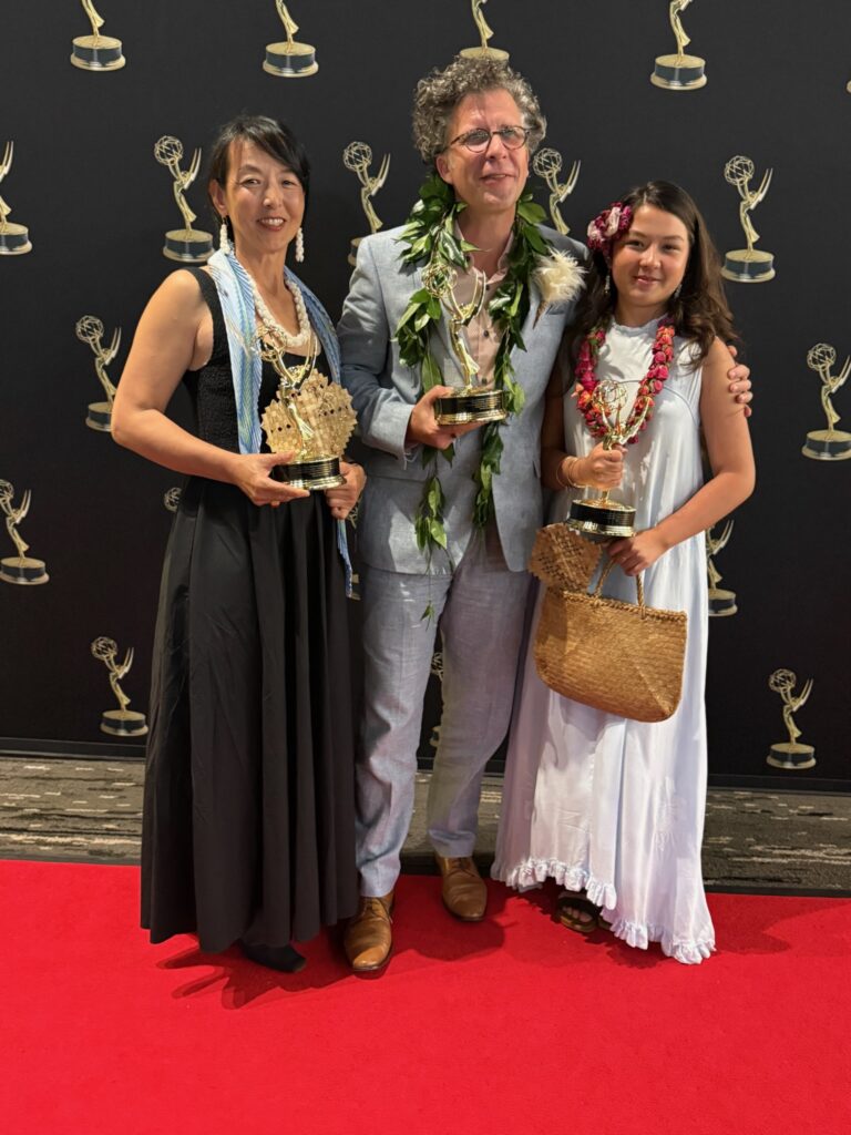 Stephan Boeker poses with Kazuko and Frida while the family holds Pacific Storytellers’ three Emmy statuettes.