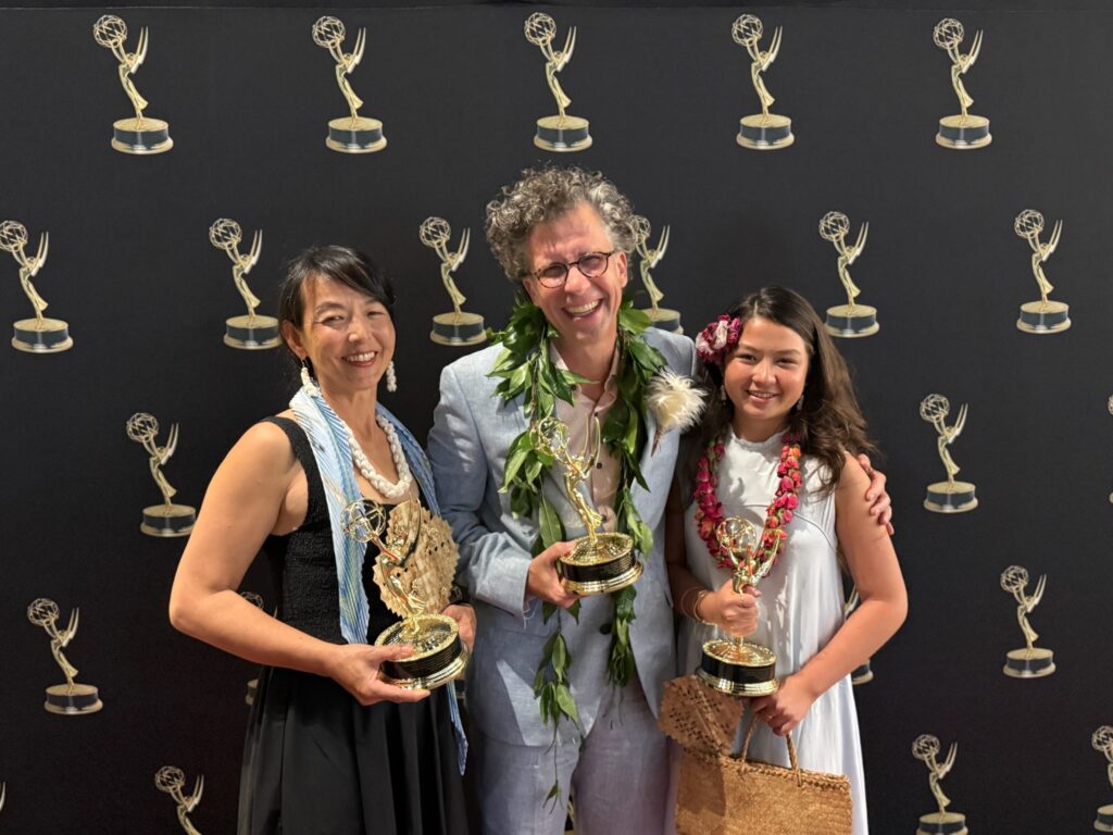 Stephan Boeker poses with Kazuko and Frida while the family holds Pacific Storytellers’ three Emmy statuettes.