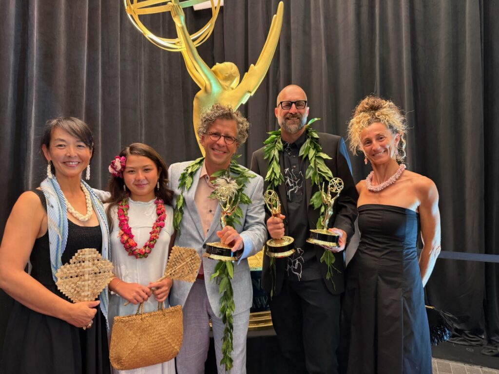 The Journey Beyond the Grid ceremony party poses with Pacific Storytellers’ three Emmy statuettes.